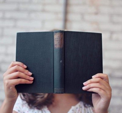 Woman Reading Hardback Book